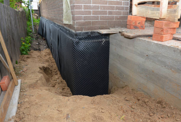 Happy homeowners after waterproofing job in Commercial Point